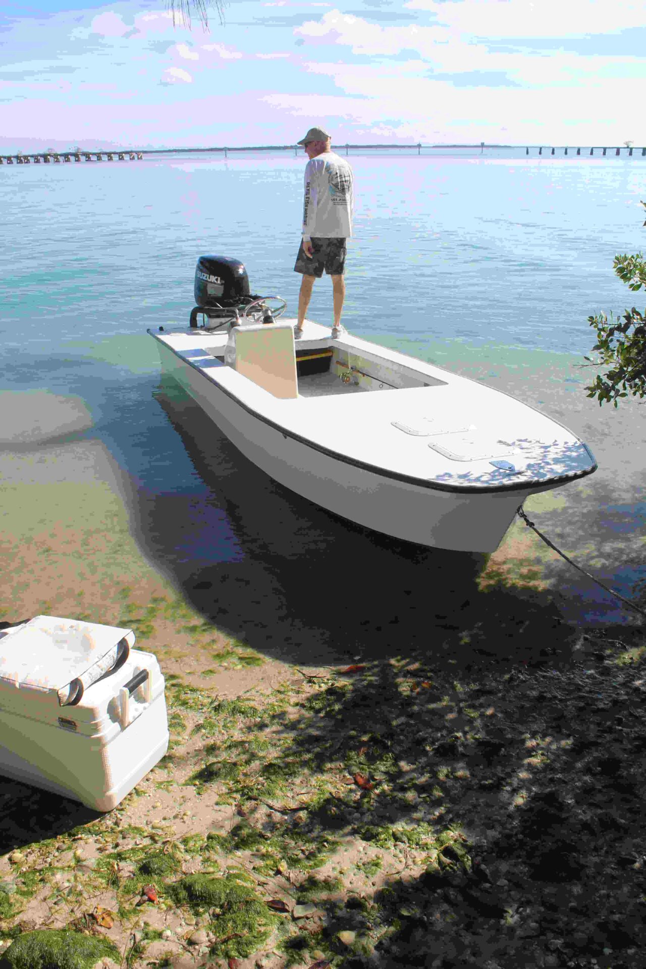 a man standing on a parked boat